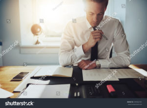 stock photo serious business man working on documents looking concentrated with briefcase and phone on the table 339364181 3 300x220 - stock-photo-serious-business-man-working-on-documents-looking-concentrated-with-briefcase-and-phone-on-the-table-339364181-3